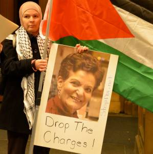 Rasmea Odeh supporter holds sign at a rally.